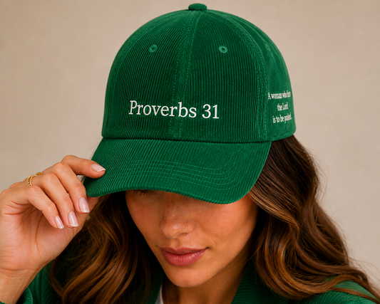 Green corduroy cap with 'Proverbs 31' text with a side logo that say A woman who fears the Lord is to be praised 